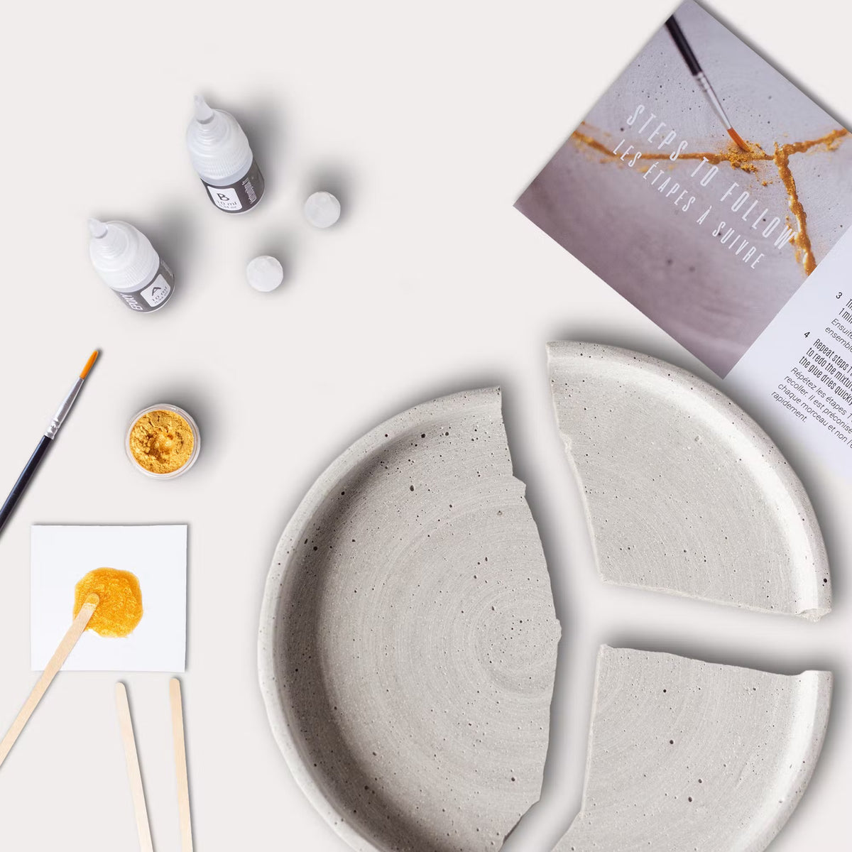 zerbrochener Teller und Kintsugi-Mischung #farbe_Gold