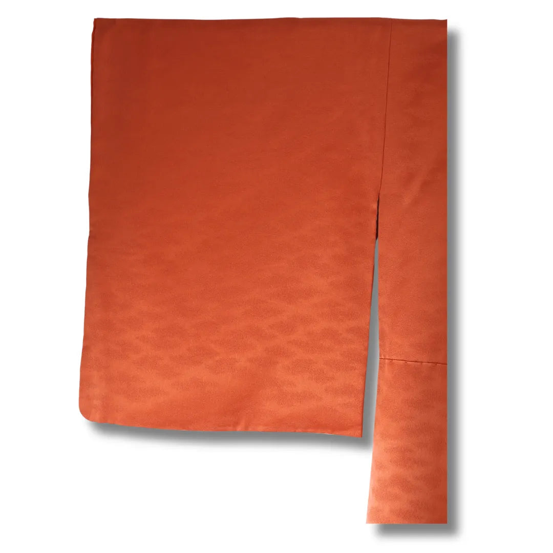 Detailaufnahme Stoff in Orange mit feiner Struktur