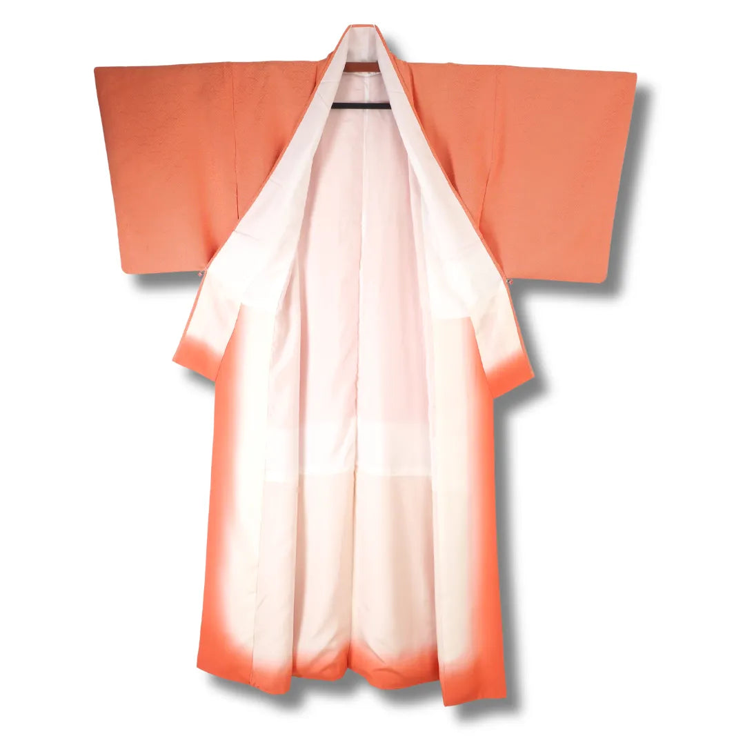 Detailaufnahme Kimono Stoff in Orange mit Bogenmuster