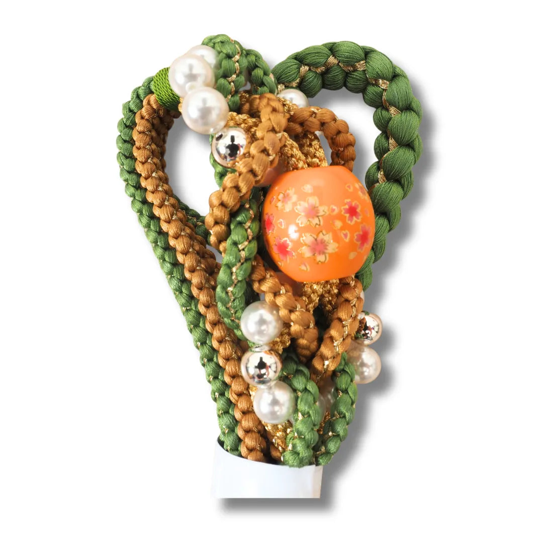 Vorgeformter Zierknoten mit großer orangefarbener Perle und kleinen weißen Perlen