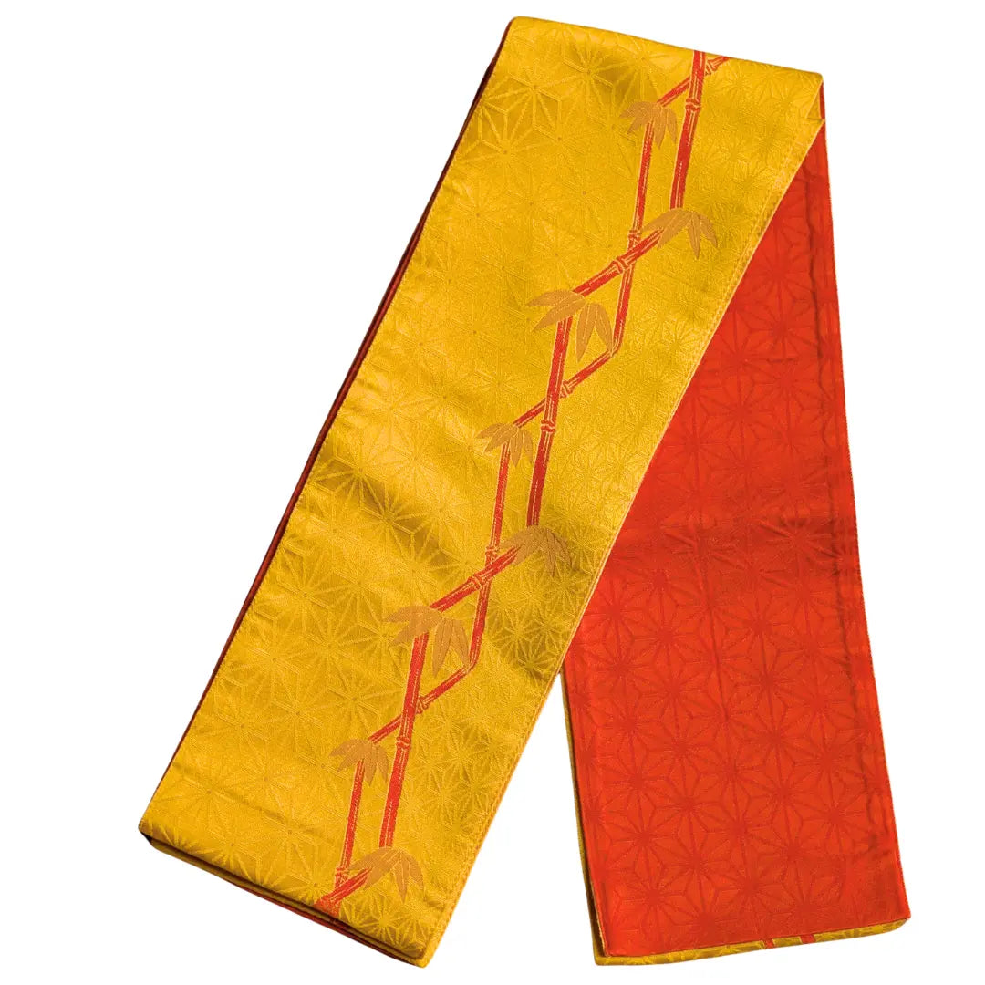 Vintage Hanhaba Wendeobi mit orangefarbener Asanoha-Seite und goldgelber Bambus-Seite.