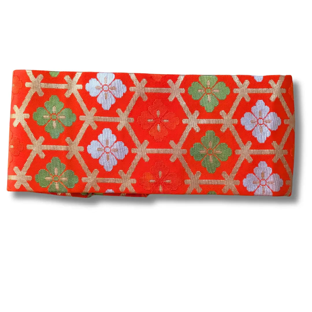 Obi Vintage Musubi Obi Schleife mit traditionellem Hanabishi-Muster in Orange und Gold.